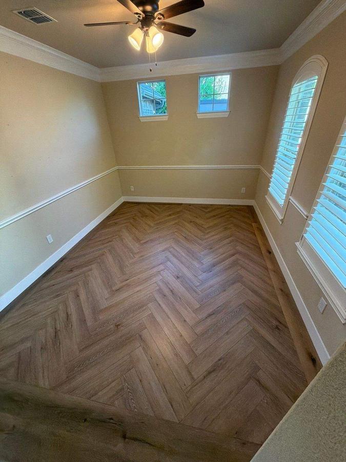Herringbone LVP flooring installed in a dining room